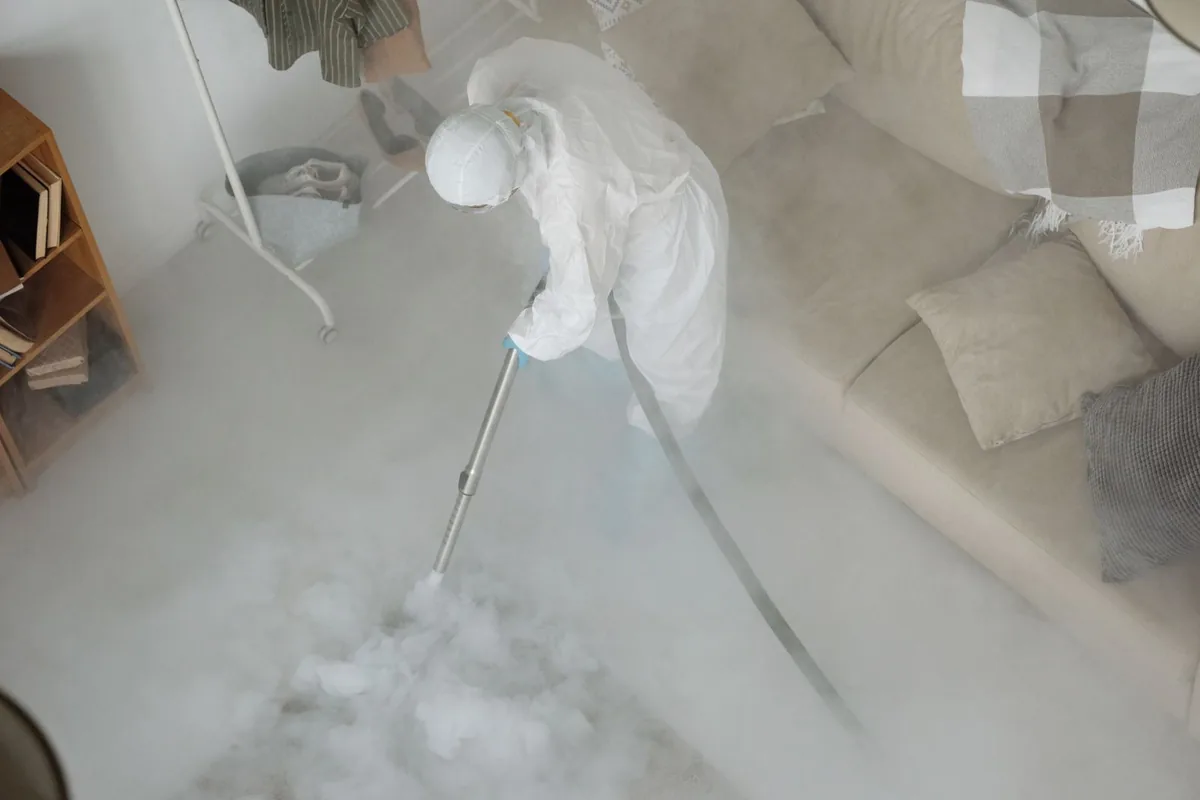 Biohazard cleanup technician in protective equipment, West Liberty, KY
